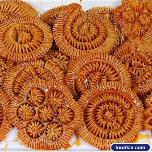 নকশি পিঠা আখের গুড় শিরা